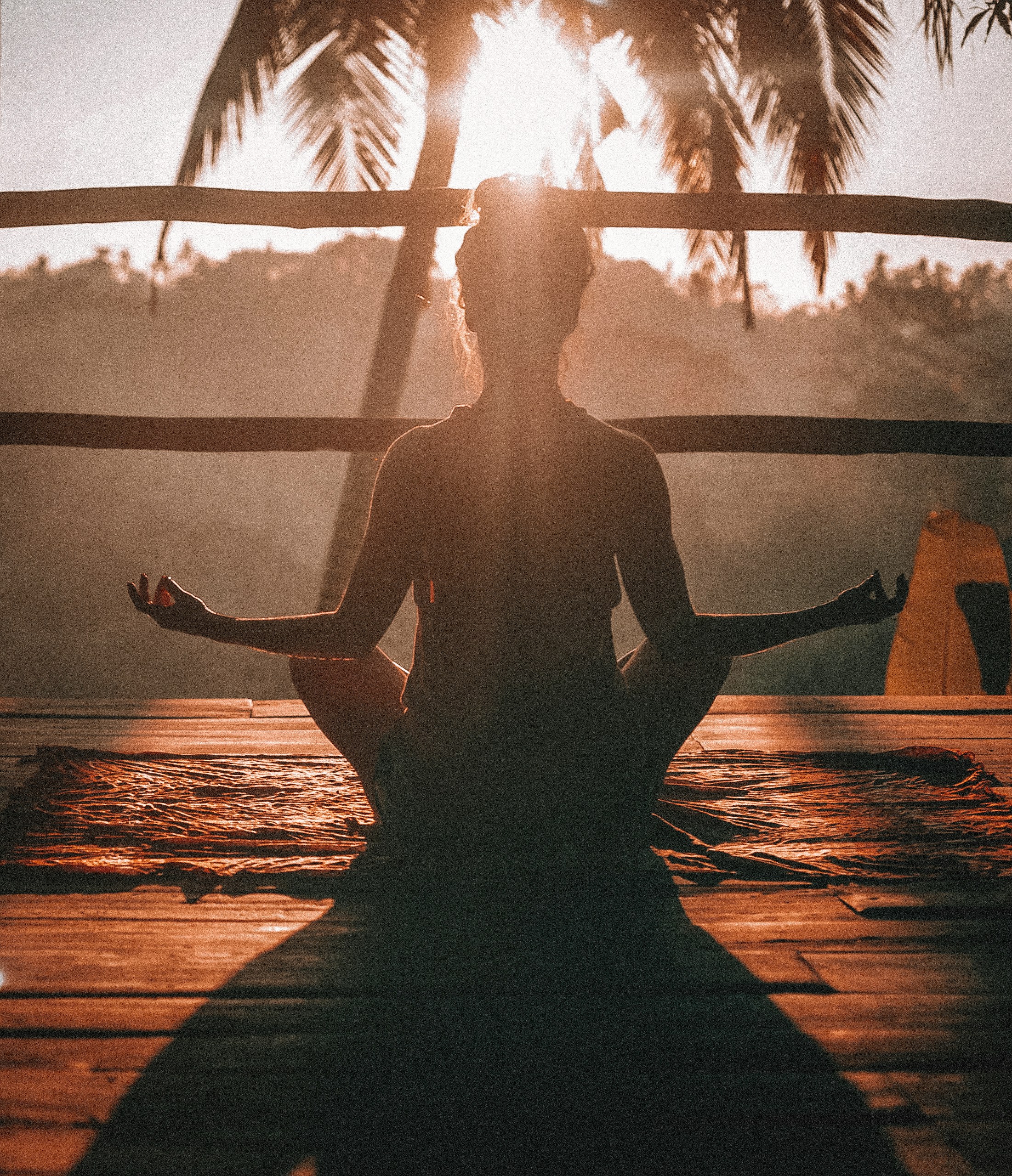 Meditation on a shaded deck at sunrise